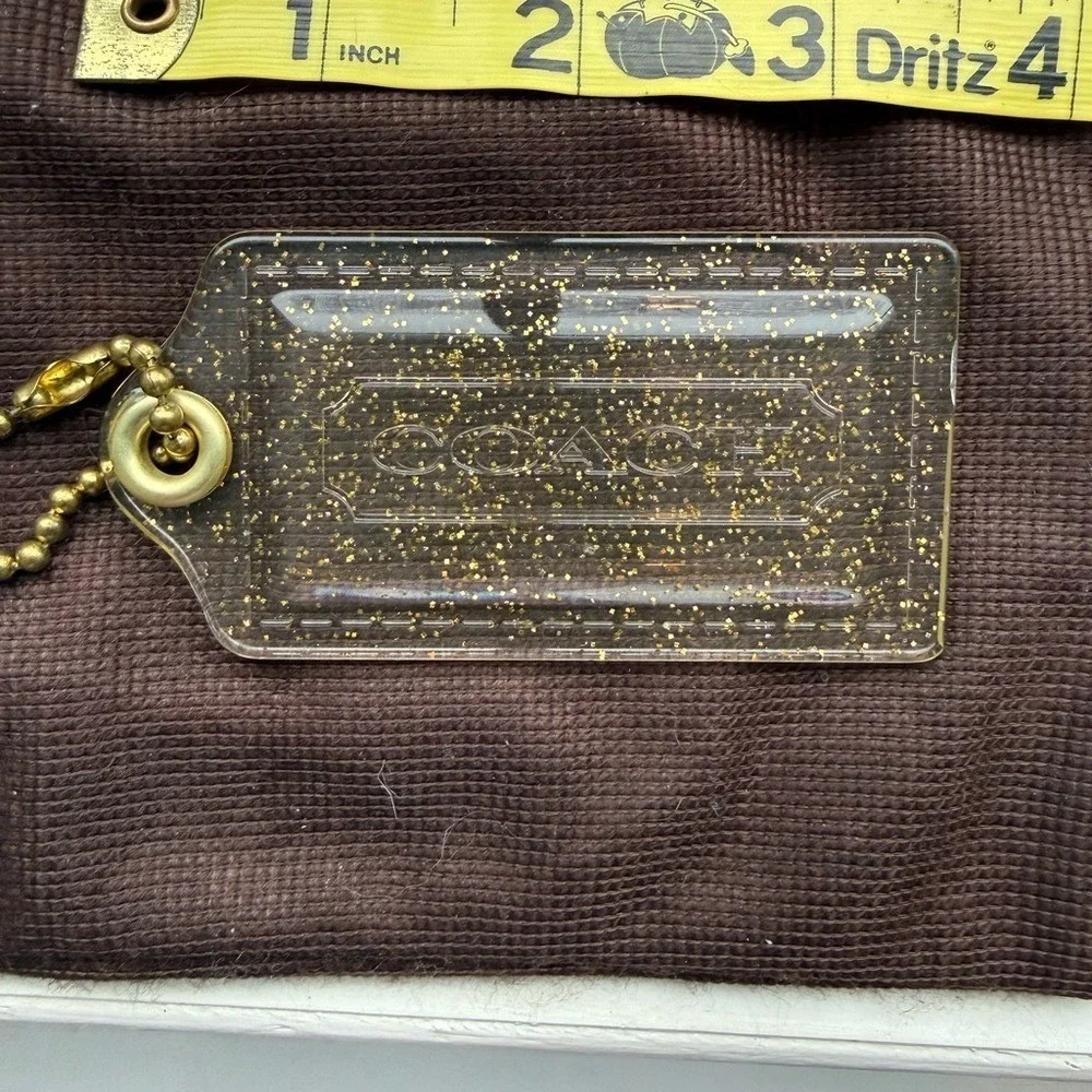 Coach Poopy Clear and gold Glitter Hang Tag
